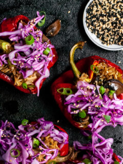 Roasted Peppers Stuffed with Sesame Ginger Mushrooms, Tofu and Rice, Topped with Red Cabbage Slaw
