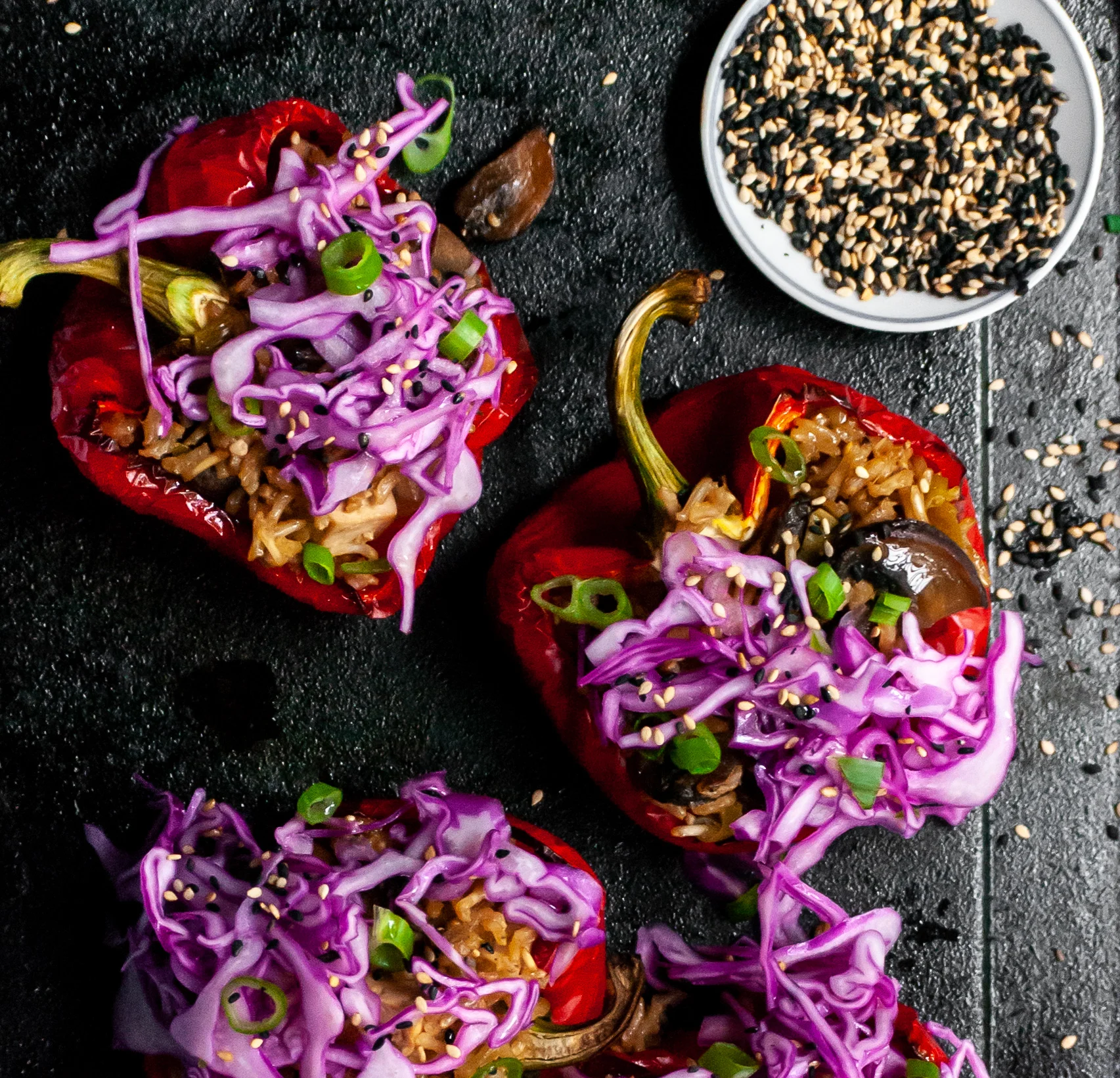 Roasted Peppers Stuffed with Sesame Ginger Mushrooms, Tofu and Rice, Topped with Red Cabbage Slaw