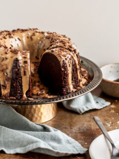 Vegan Chocolate Bundt Cake with Salted Peanut Butter Glaze sliced and being served