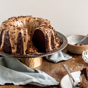 Vegan Chocolate Bundt Cake with Salted Peanut Butter Glaze sliced and being served