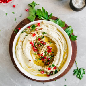 Roasted Pumkin Seed Hummus served with pomengrante seeds, olive oil drizzle and fresh parsley
