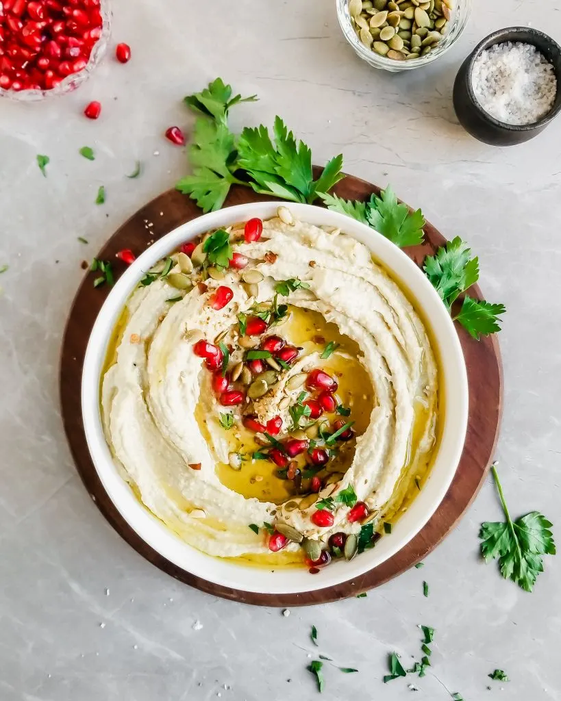 Roasted Pumkin Seed Hummus served with pomengrante seeds, olive oil drizzle and fresh parsley