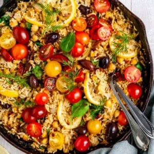 One-Skillet Baked Greek Lemon Chickpeas and Rice fresh out of the oven garnished wth fresh dill