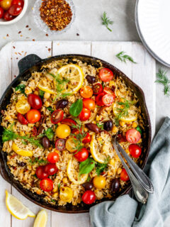 One-Skillet Baked Greek Lemon Chickpea and Rice ready to be served on white plates