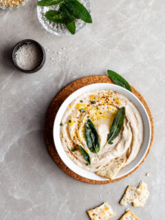 Lemon Sage White Bean Dip garnished with fried sage leaves