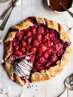 Strawberry galette with ice cream on the one slice which has been cut