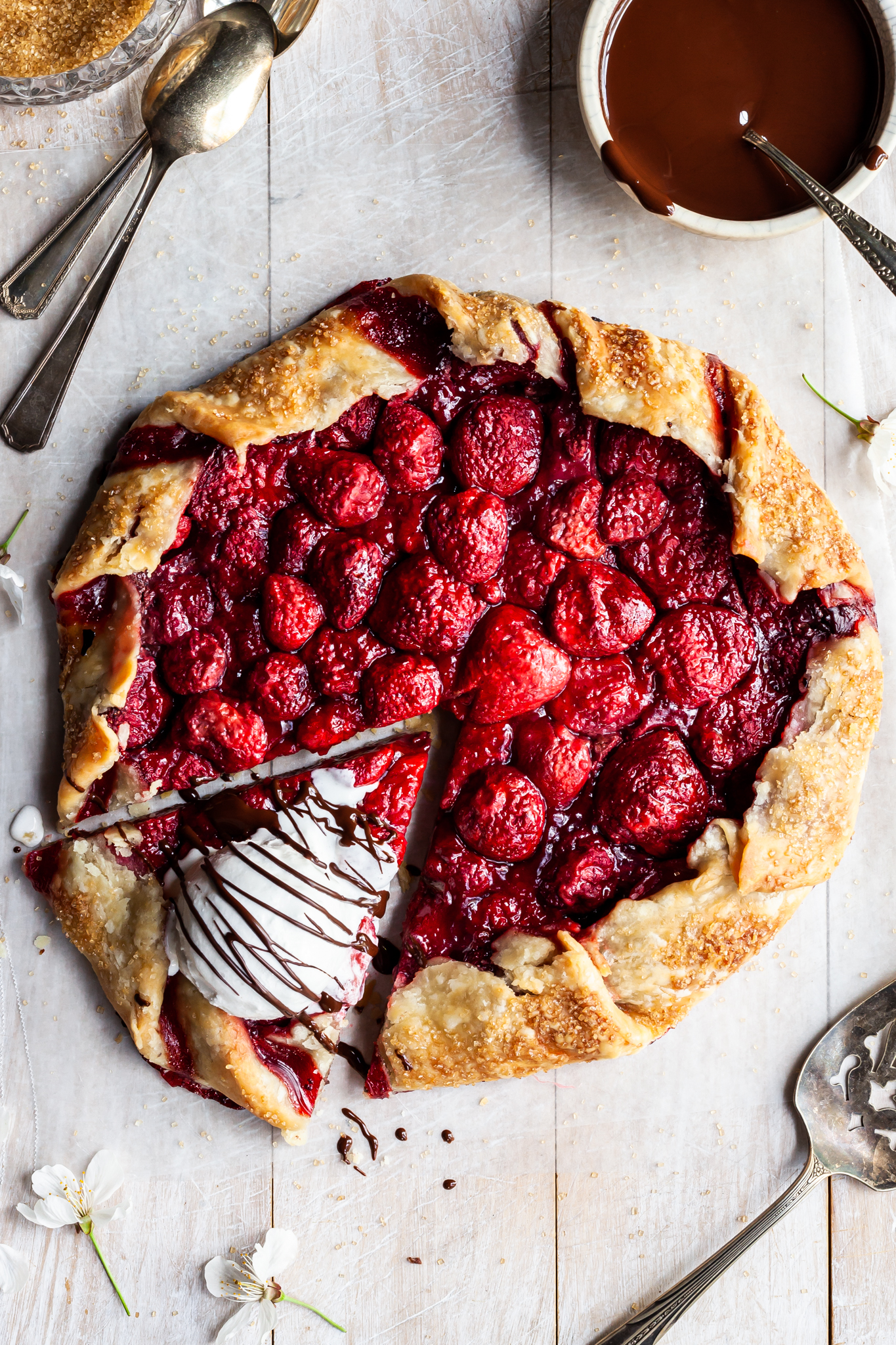 Strawberry galette with ice cream on the one slice which has been cut