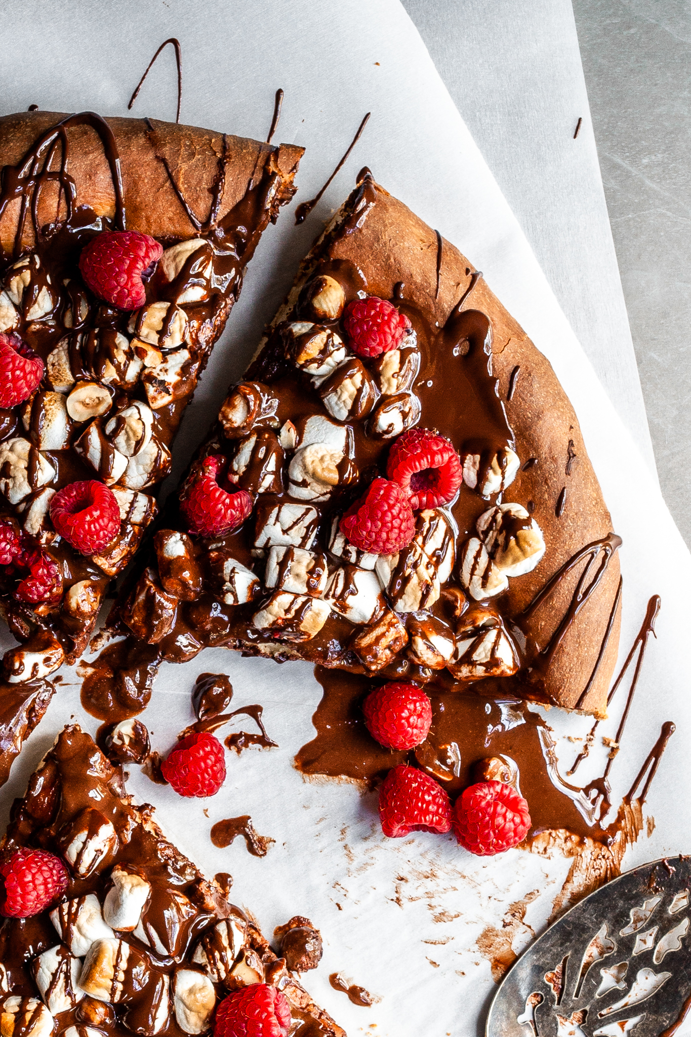 Cropped view of a dessert pizza covered in chocolate and marshmallows