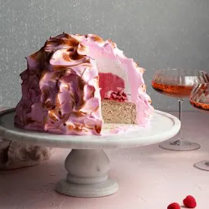 Pink baked alaska with a pink and white ice cream filling