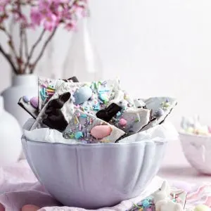 A white bowl filled chocolate candy Easter bark