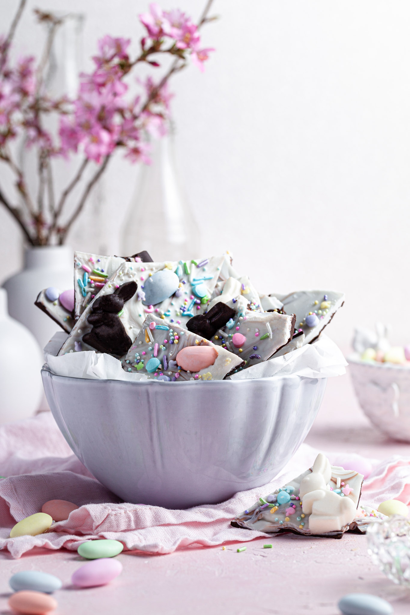 A white bowl filled chocolate candy Easter bark